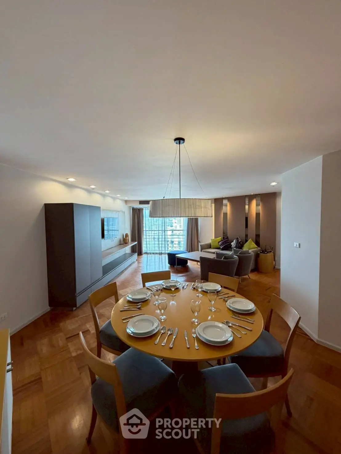 Spacious living room with elegant dining area and modern decor