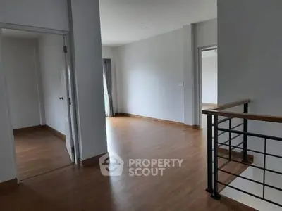 Spacious modern interior with wooden flooring and open layout