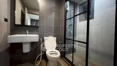 Modern bathroom with sleek design and glass shower enclosure
