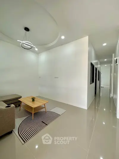 Modern living room with sleek design and stylish lighting in a contemporary home.