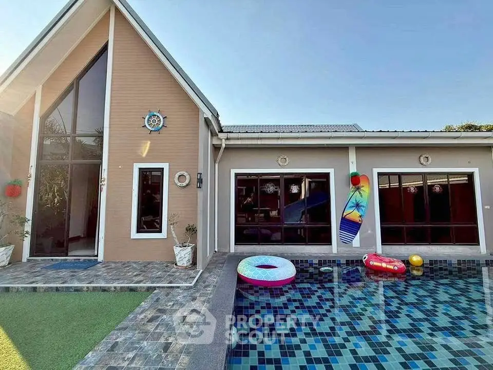 Charming modern home with private pool and stylish exterior design.