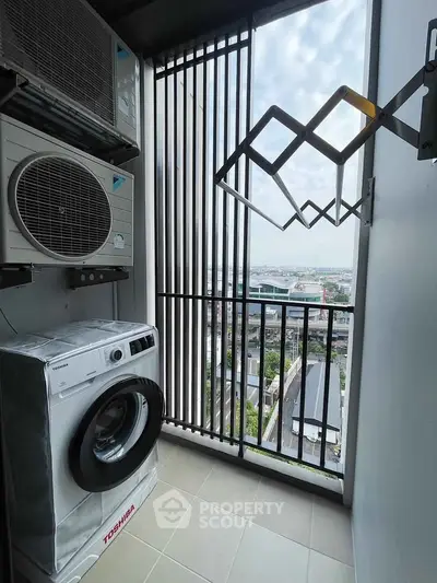 Modern apartment balcony with washing machine and city view