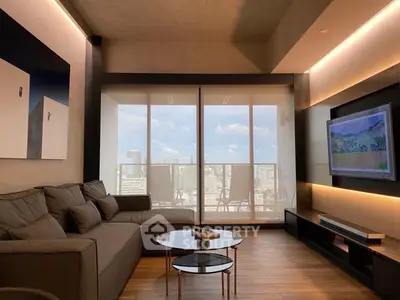 Modern living room with city view, stylish furniture, and sleek design.