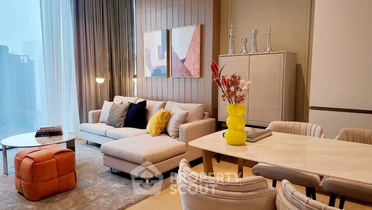 Modern living room with stylish decor and city view, featuring cozy seating and elegant dining area.