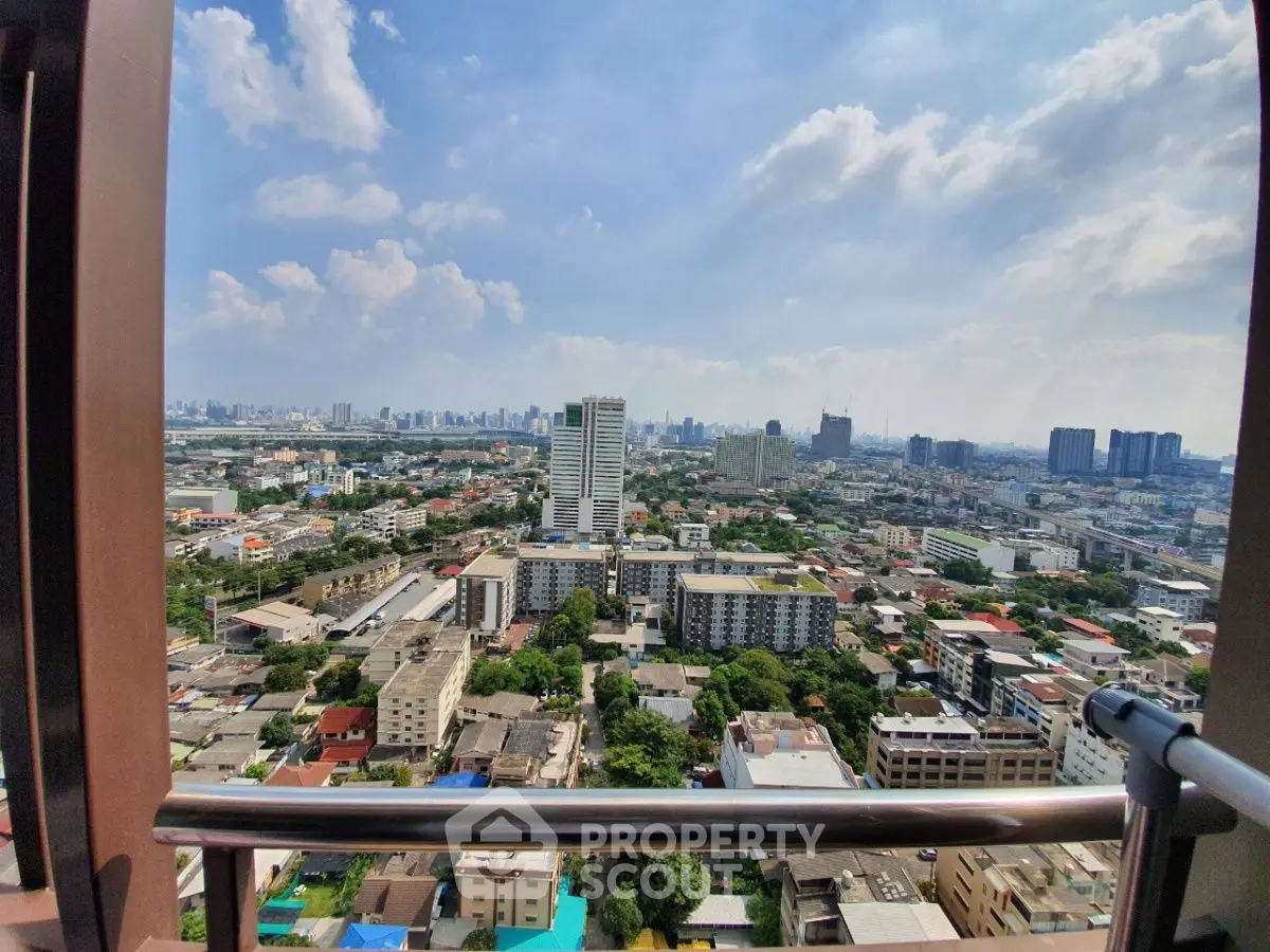 Stunning cityscape view from high-rise balcony showcasing urban skyline and vibrant neighborhood.