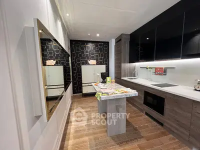 Modern kitchen with sleek design, featuring dark cabinets, a stylish island, and contemporary decor.