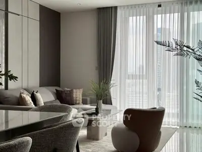 Elegant modern living room with stylish furniture and large window view.