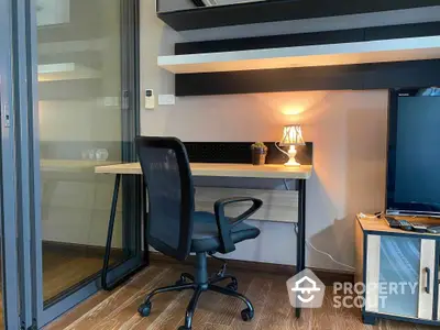 Modern compact study area with sleek shelving, warm lighting, and a comfortable office chair, perfect for focused work sessions.