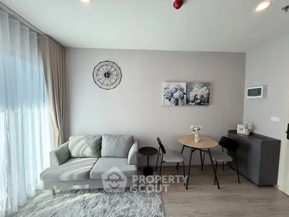 Modern living room with stylish decor and cozy seating area, perfect for relaxation and entertaining.