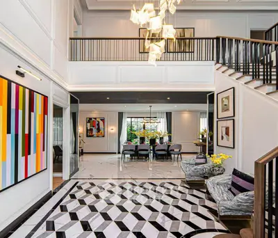 Luxurious modern living room with high ceiling and elegant decor