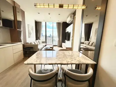 Luxurious modern living room with city view, elegant marble dining table, and stylish decor.