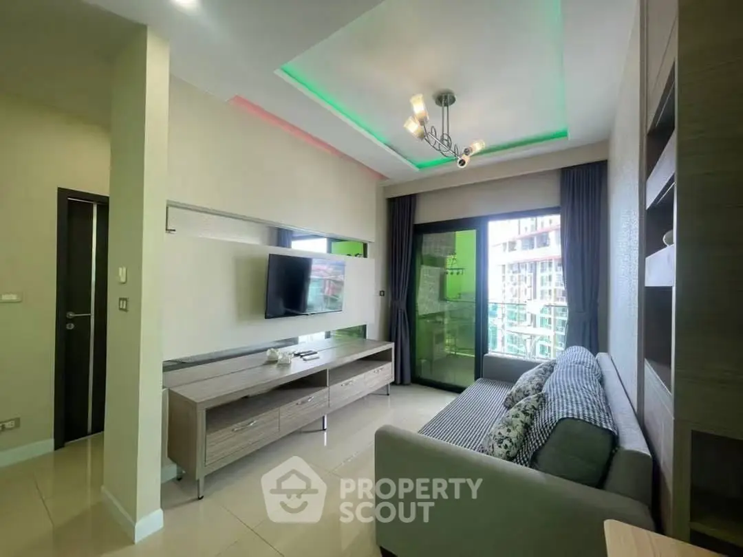 Modern living room with stylish ceiling lights and balcony view