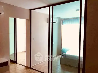 Modern bedroom with glass partition and natural light