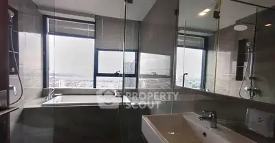 Luxurious bathroom with panoramic city view and modern fixtures