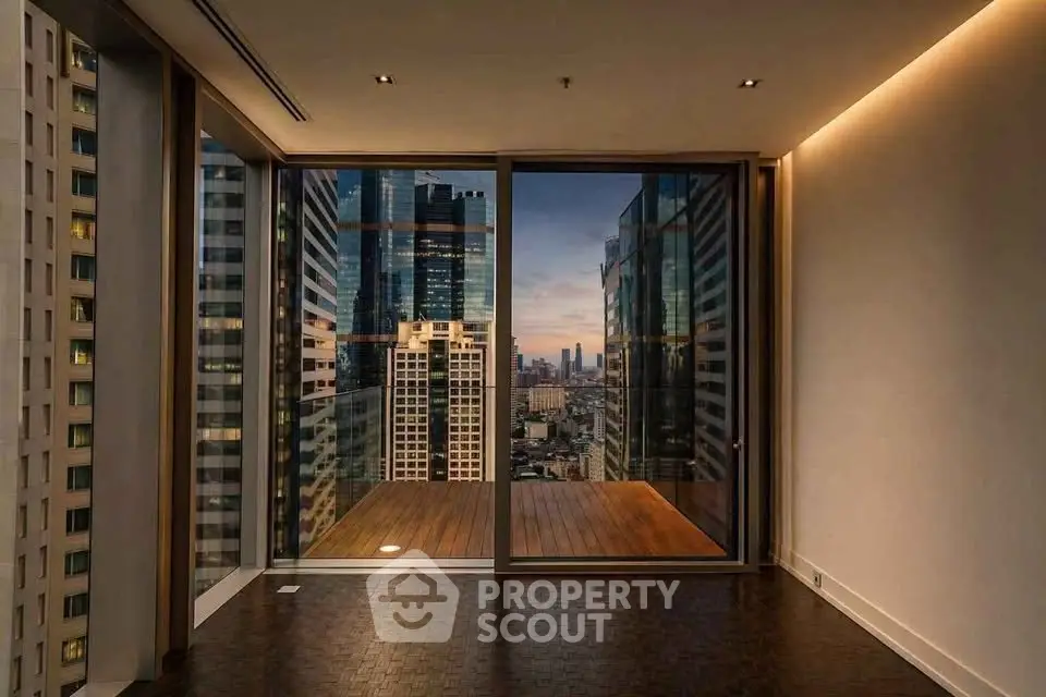 Luxurious high-rise apartment with stunning city view and spacious balcony.