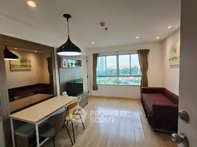 Modern living room with dining area and large window offering city view