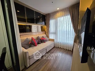 Modern living room with cozy sofa and stylish decor in a bright apartment.