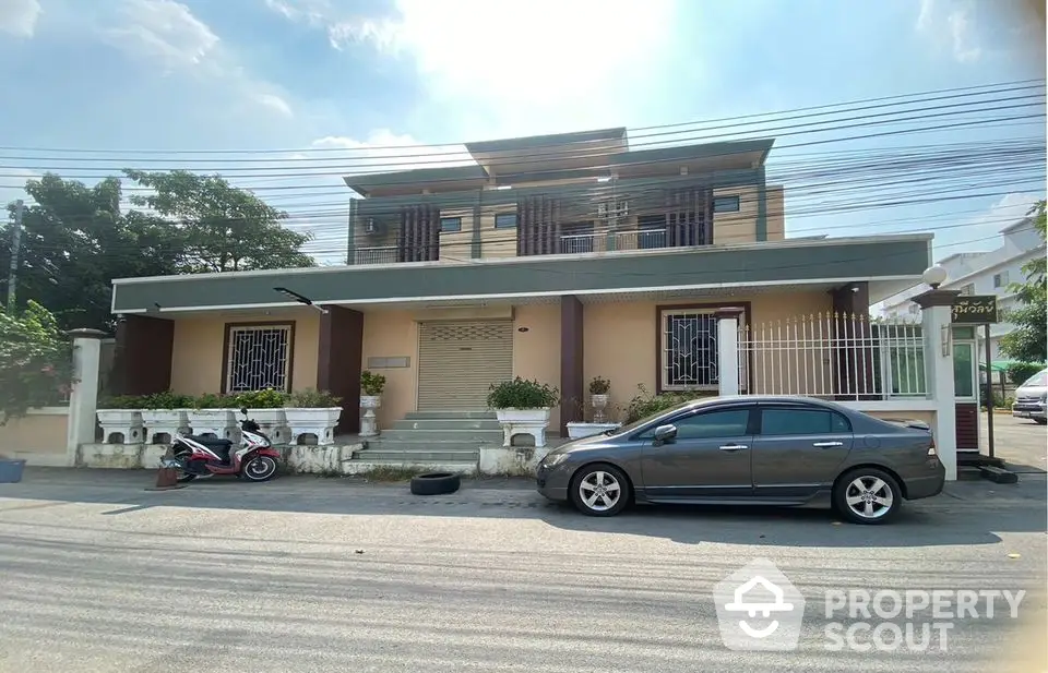 Spacious two-story house with modern facade and ample parking space