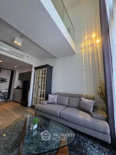 Modern living room with high ceiling and stylish decor in a luxury apartment