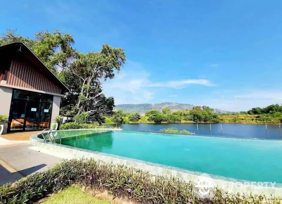 Stunning lakeside property with infinity pool and scenic mountain views