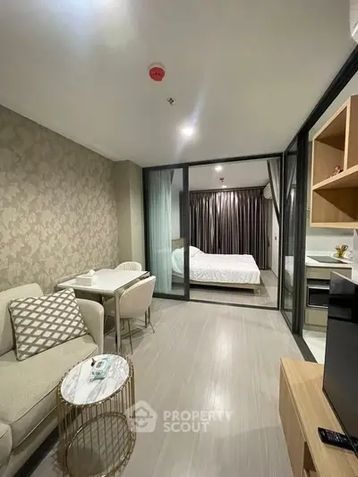 Modern studio apartment with cozy living area and stylish bedroom