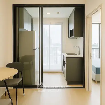 Modern compact kitchen with sleek cabinetry and city view from balcony.
