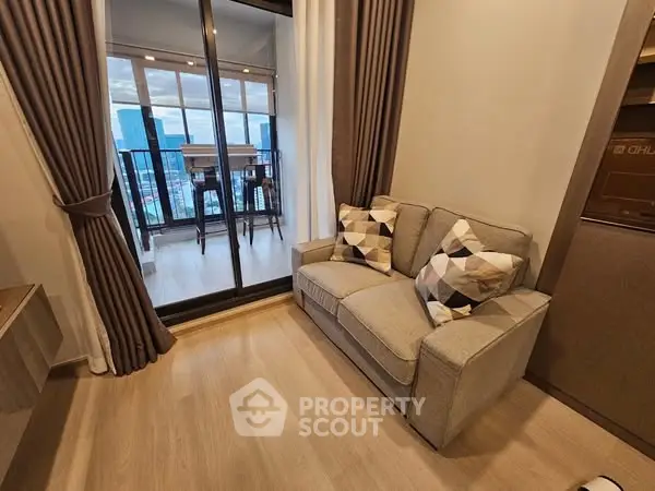 Modern living room with cozy sofa and city view balcony
