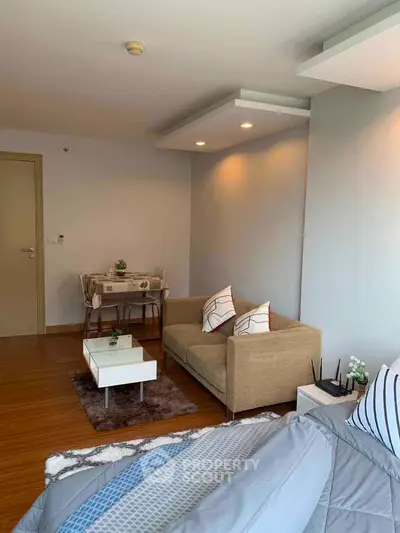 Cozy studio apartment with modern decor and compact living area