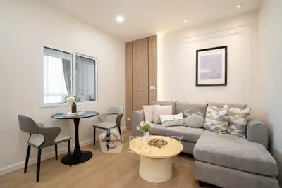 Modern living room with cozy gray sofa and stylish decor