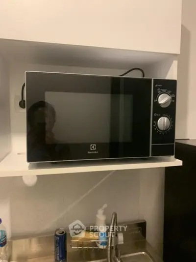 Modern kitchen with Electrolux microwave and sleek design