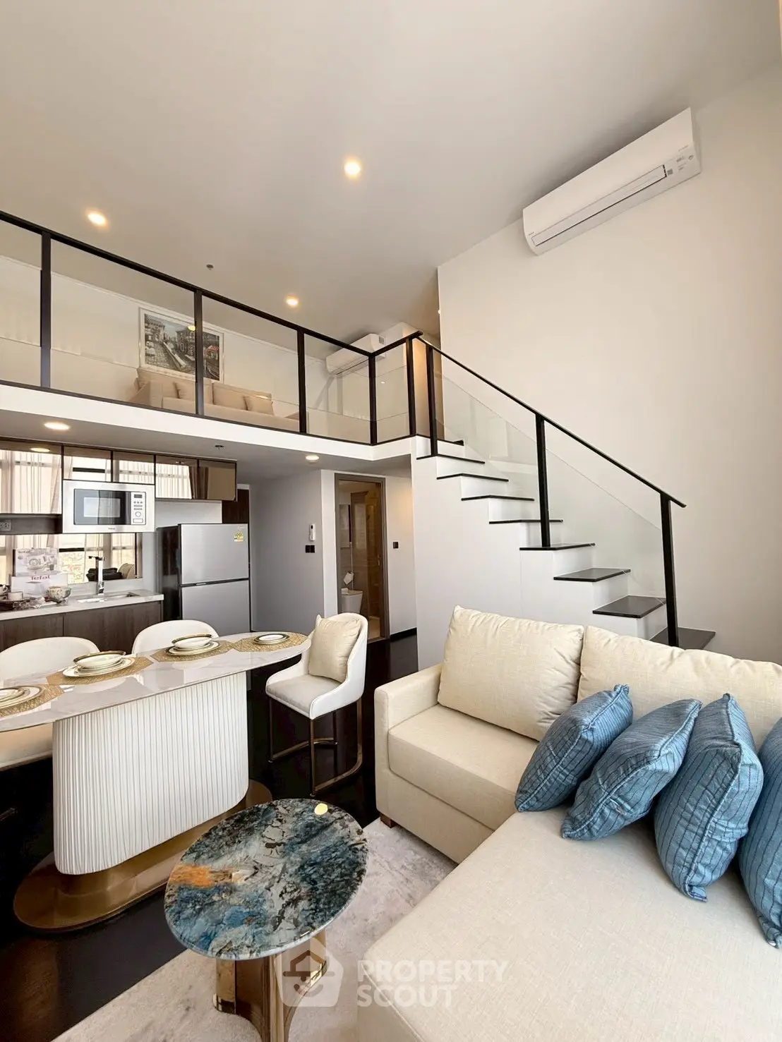 Modern duplex living room with stylish decor and mezzanine level