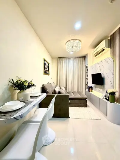 Modern living room with elegant decor, cozy sofa, and stylish lighting in a contemporary apartment.