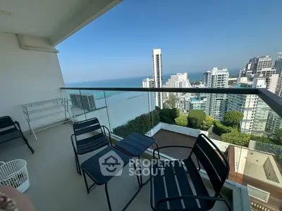 Spacious balcony with stunning city and ocean views, perfect for relaxation and entertainment.