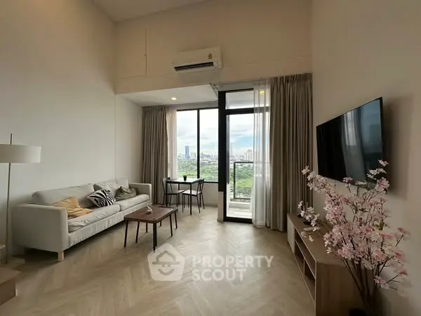 Modern living room with city view, stylish decor, and large windows.