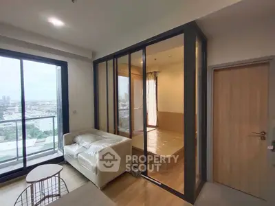 Modern condo with glass-enclosed bedroom and city view balcony