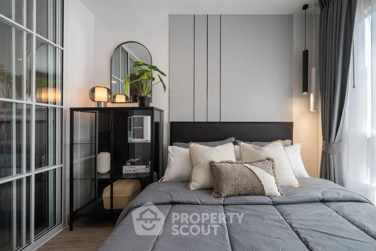 Modern bedroom with stylish decor and natural light