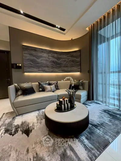 Luxurious modern living room with elegant decor and large windows