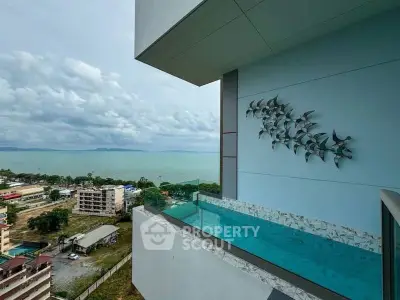 Stunning balcony with private pool and ocean view in modern high-rise building.