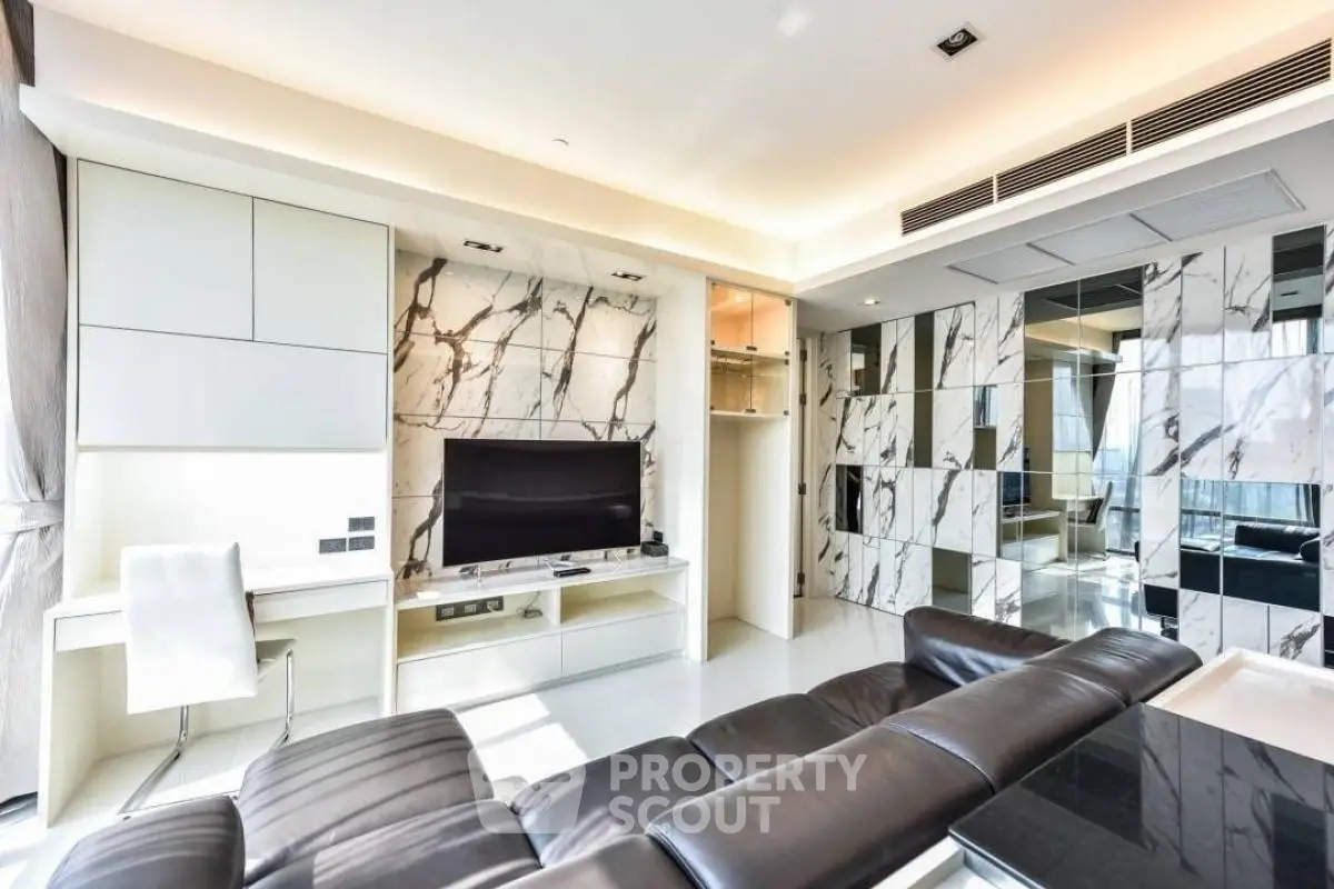 Luxurious modern living room with marble accents and sleek leather sofa