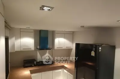 Modern kitchen with sleek cabinets and gas stove