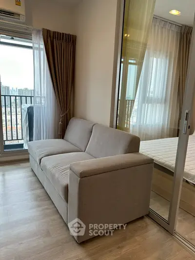 Modern apartment with cozy living room and city view from balcony