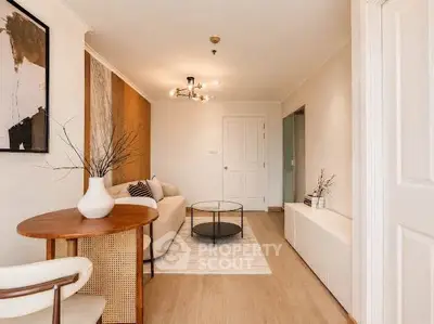 Stylish living room with modern decor and elegant lighting in a cozy apartment.