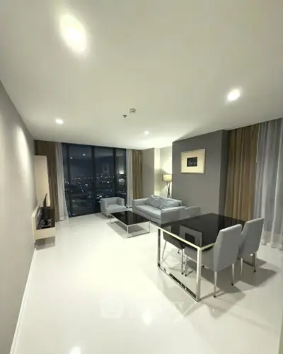 Modern living room with sleek furniture and city view