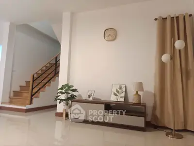 Modern living room with stylish decor and staircase