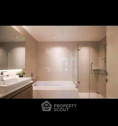 Luxurious modern bathroom with glass shower and bathtub