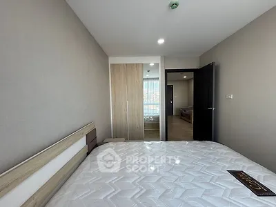 Modern bedroom with sleek design and ample natural light