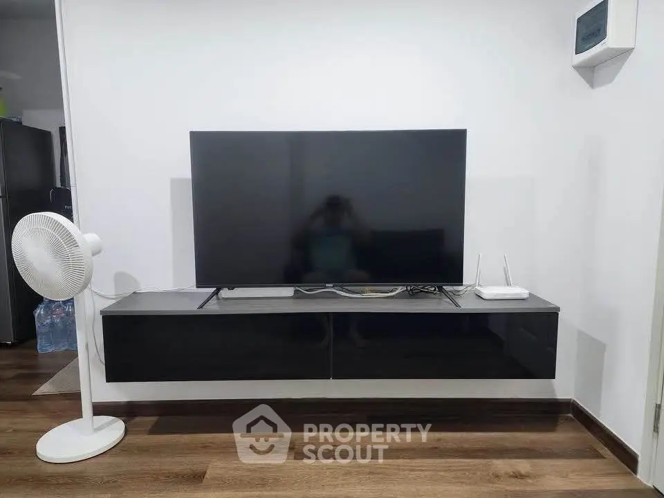 Modern living room with sleek TV setup and stylish floating cabinet