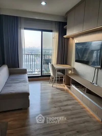 Modern living room with city view, sleek furniture, and large window for natural light.