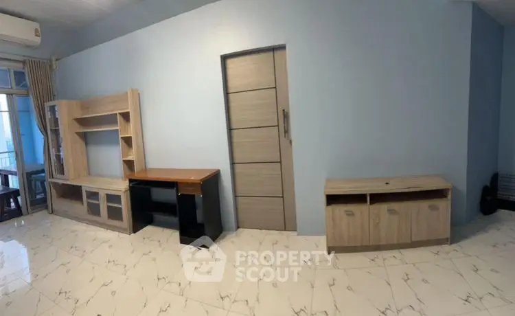 Spacious living room with modern furniture and marble flooring