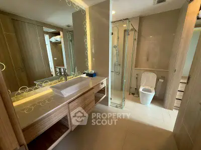 Luxurious bathroom with modern fixtures and elegant wood accents